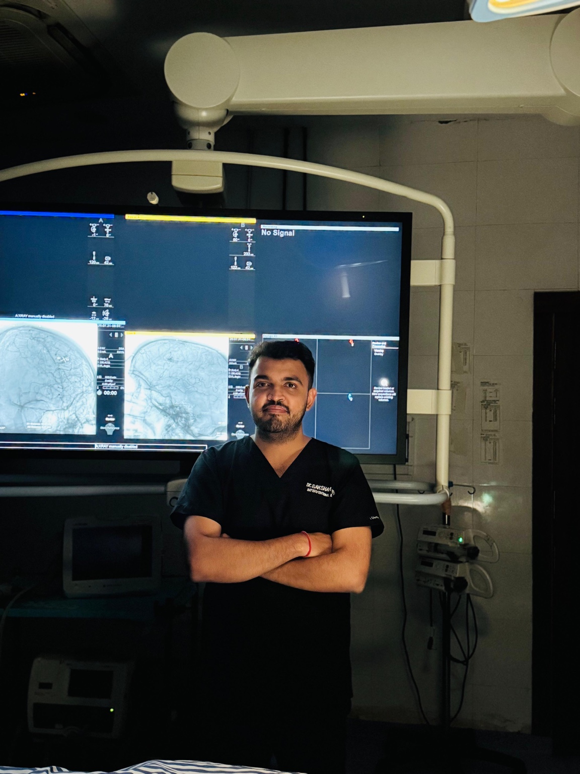 Dr. Saksham Sharma in an interventional radiology suite